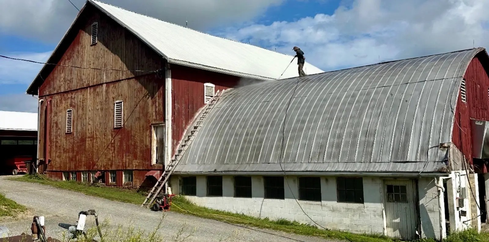 Before — Agricultural bank barn arched metal roof restored with aluminum roof coating