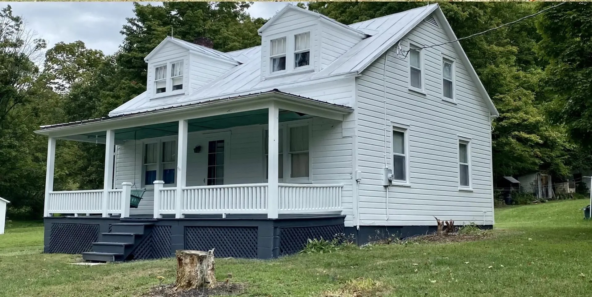 Peeling historic farmhouse restored with full exterior repaint